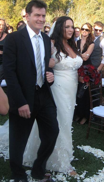 Cassandra Jade Estevez walks with her father, Charlie Sheen, down the aisle.